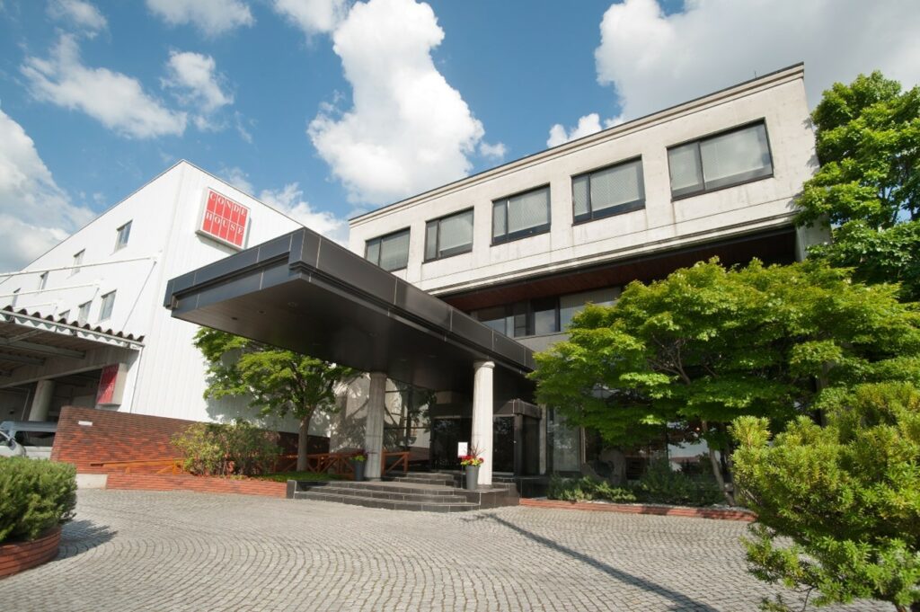 The appearnce of the building entrance of our company, on a find day under the blue sky.