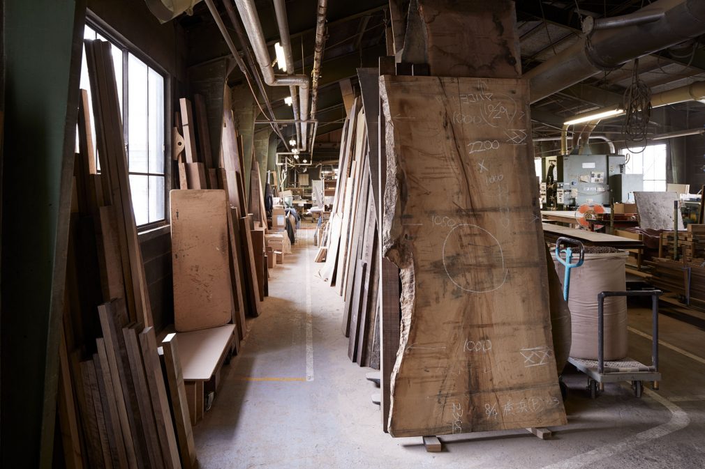 In the corner of our factory, many planks are left to be processed to tabletops.