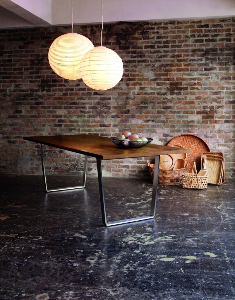 One of our dining tables, solid-wood tabletop with metal legs.