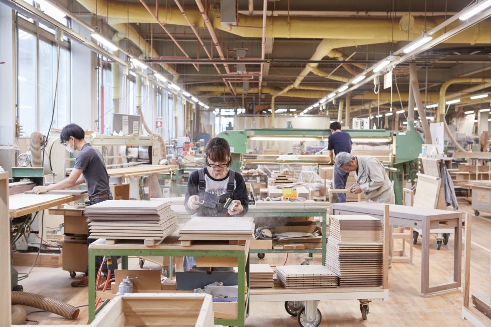 A shot of our furniture factory. Four people can be seen to work. 