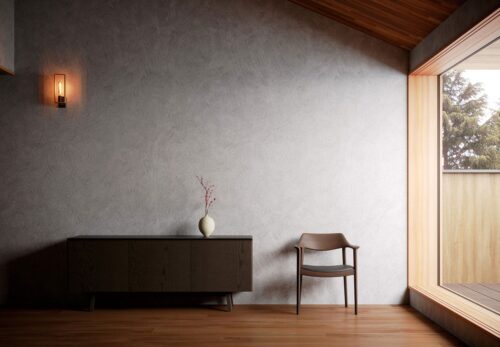 A dining chair is placed by the wall next to a low cabinet.