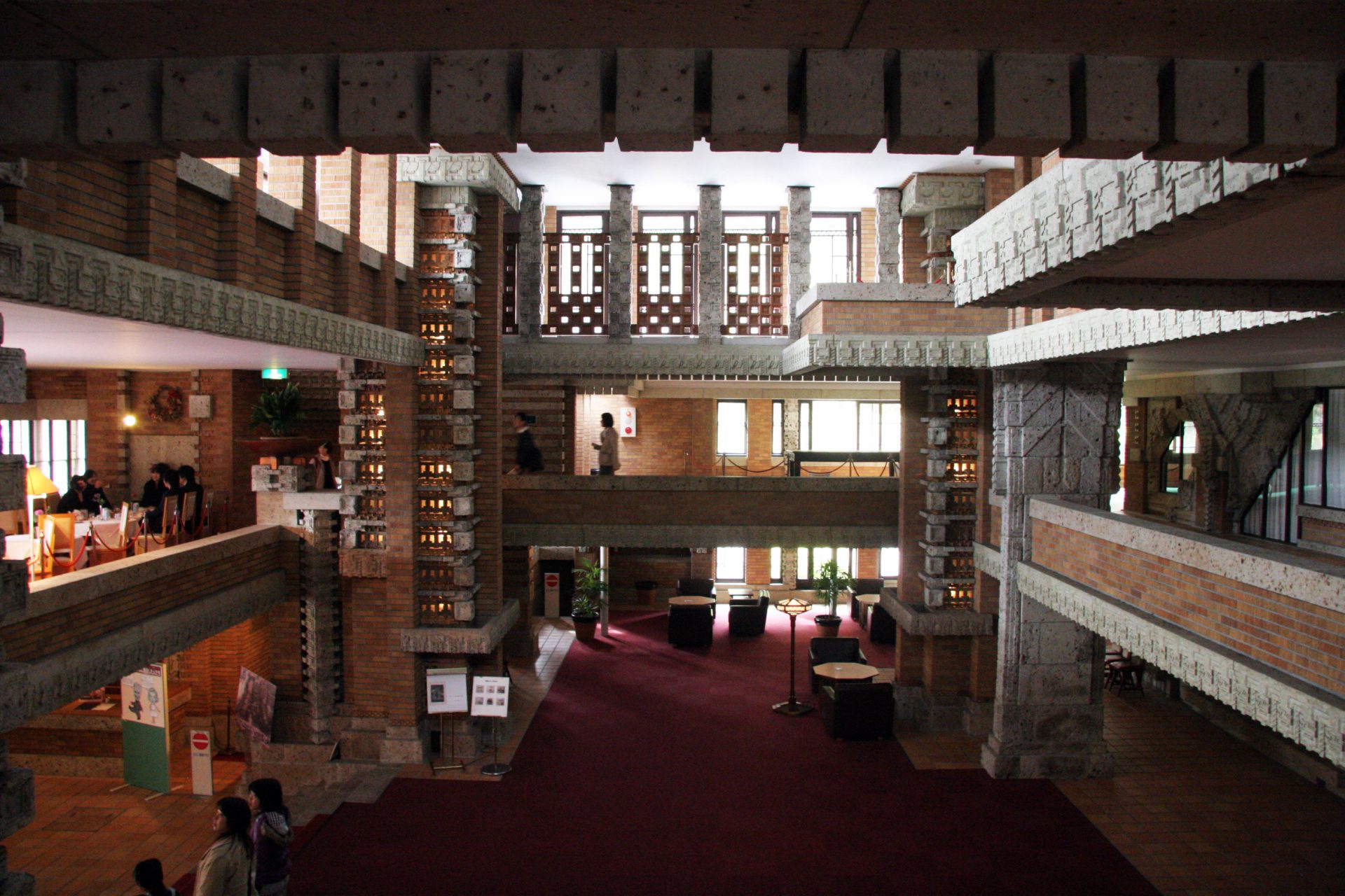 The lobby area of the old Imperial Hotel. The soft light is penetrating through the decorated wondows.