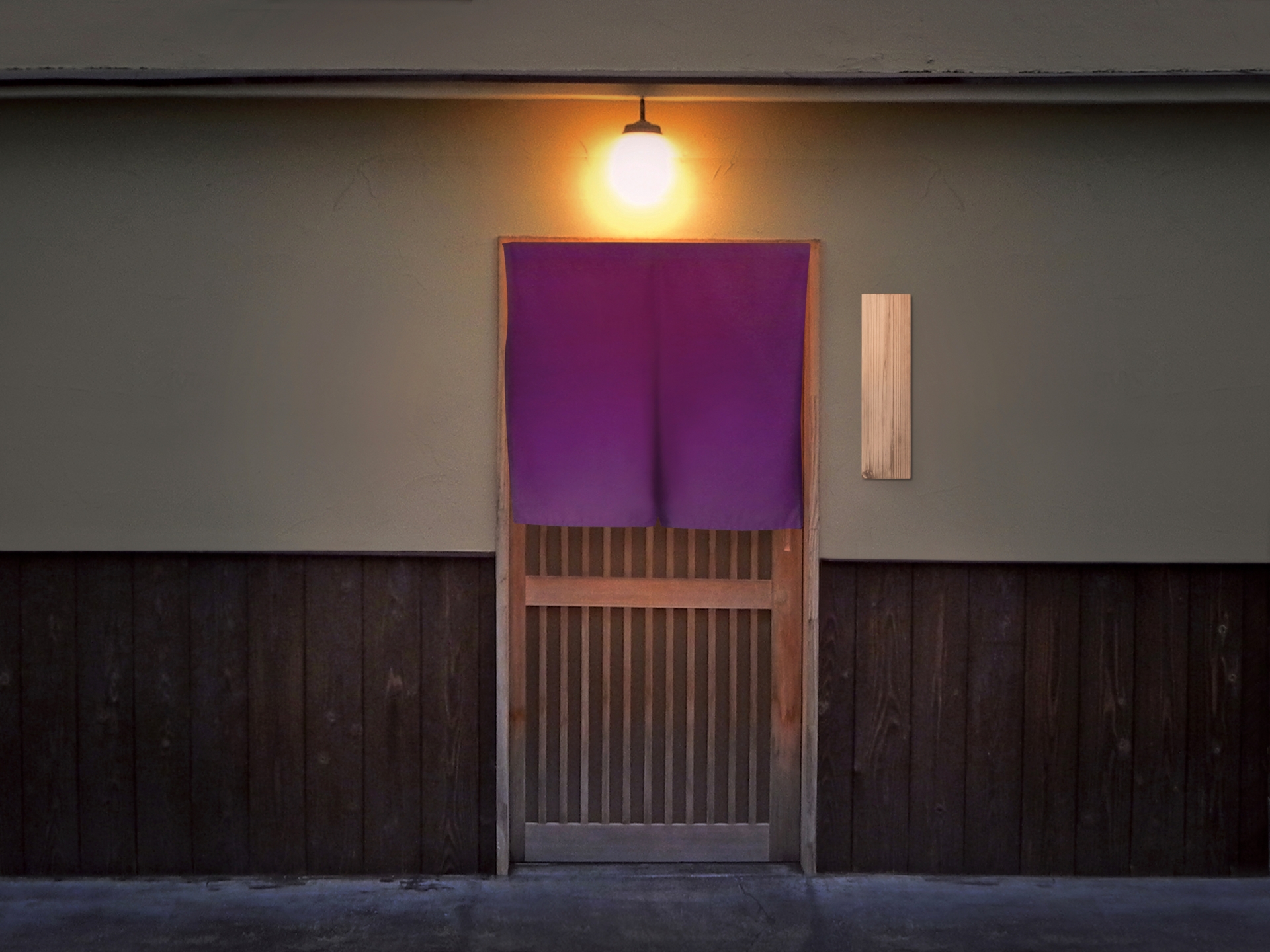 The entrance of a washoku restaurant where a purple banner is hung over the door