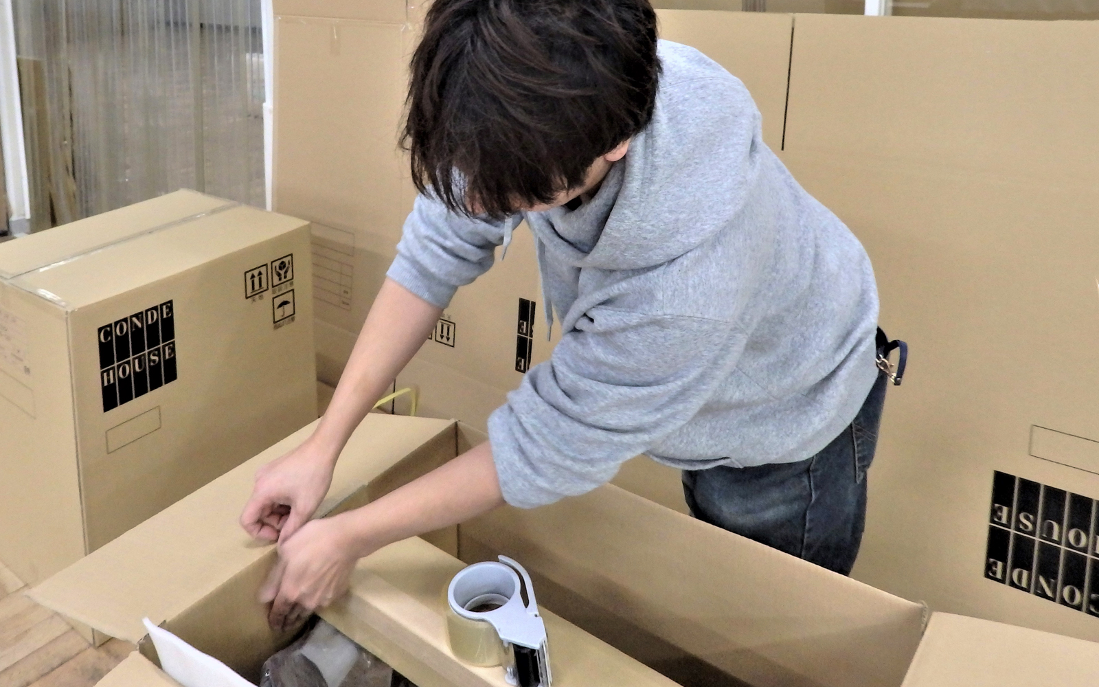 Our factory staff is packaging a dining chair.