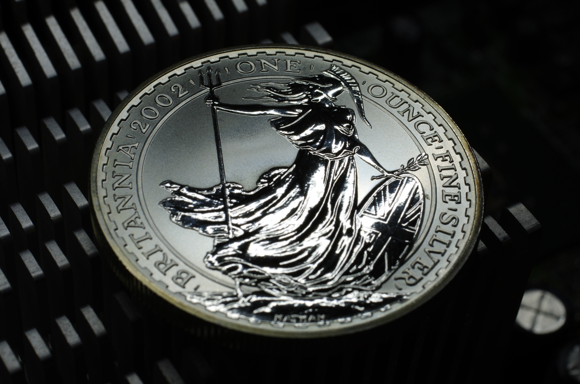 The Britania silver coin on a circuit board