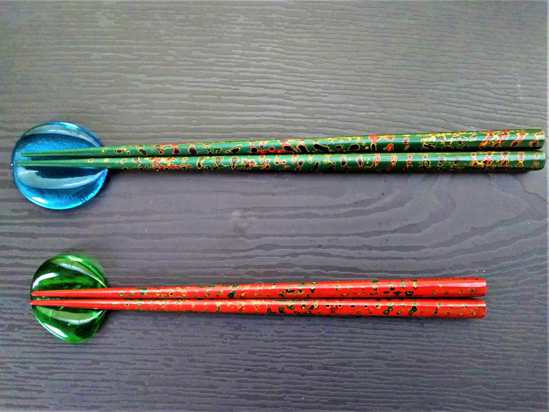 Two sets of Japanese traditional chop sticks: one is green; the other is red