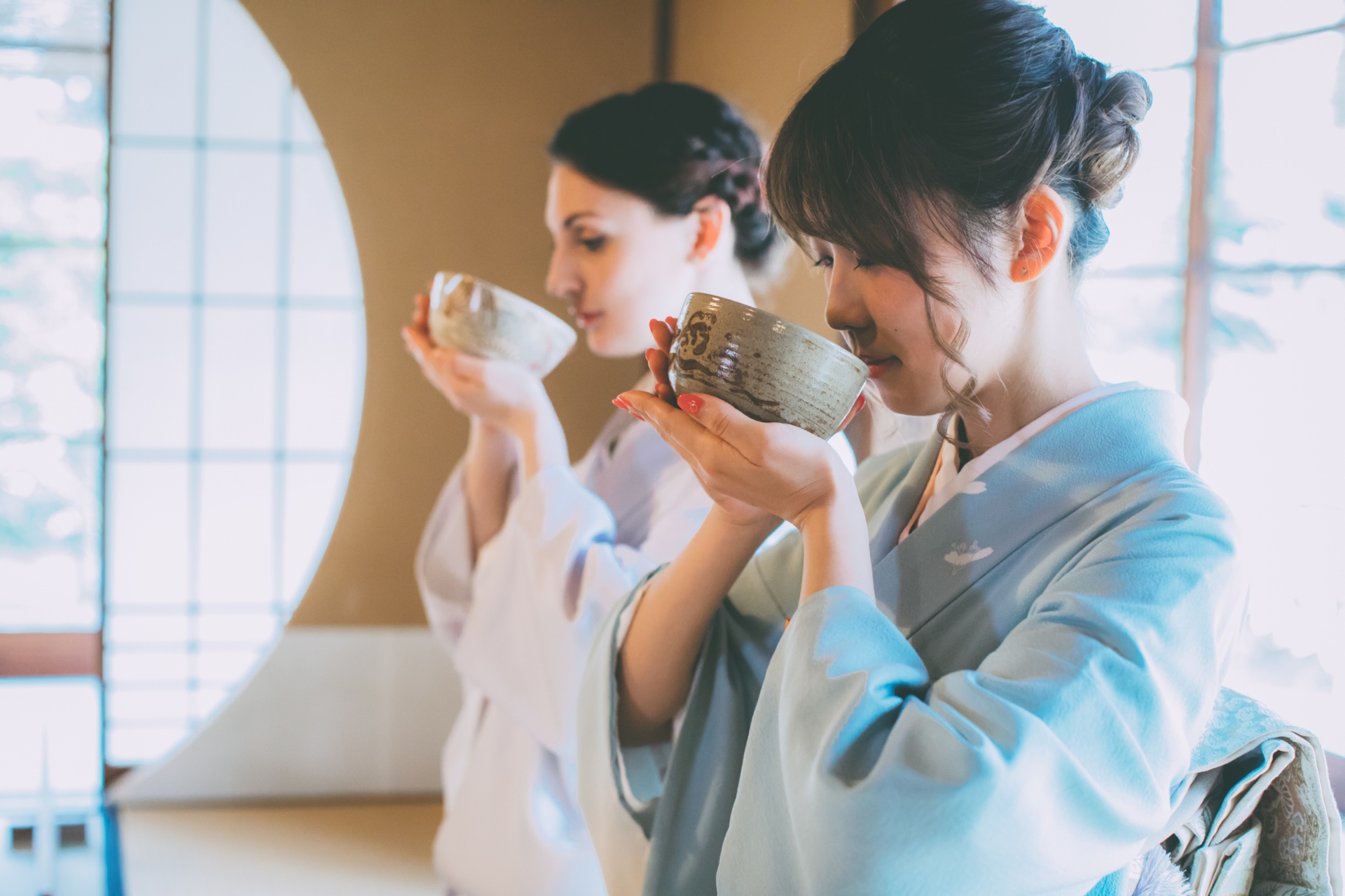 Two women drinking Japanese macha in kimono