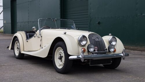 A white Morgan 4/4, of which engine has been replaced with an electric mortor.