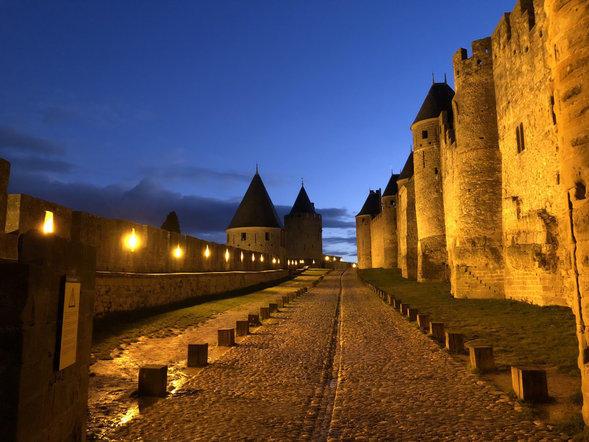 The walls of the Carcassonne fortress lighted up in the evening