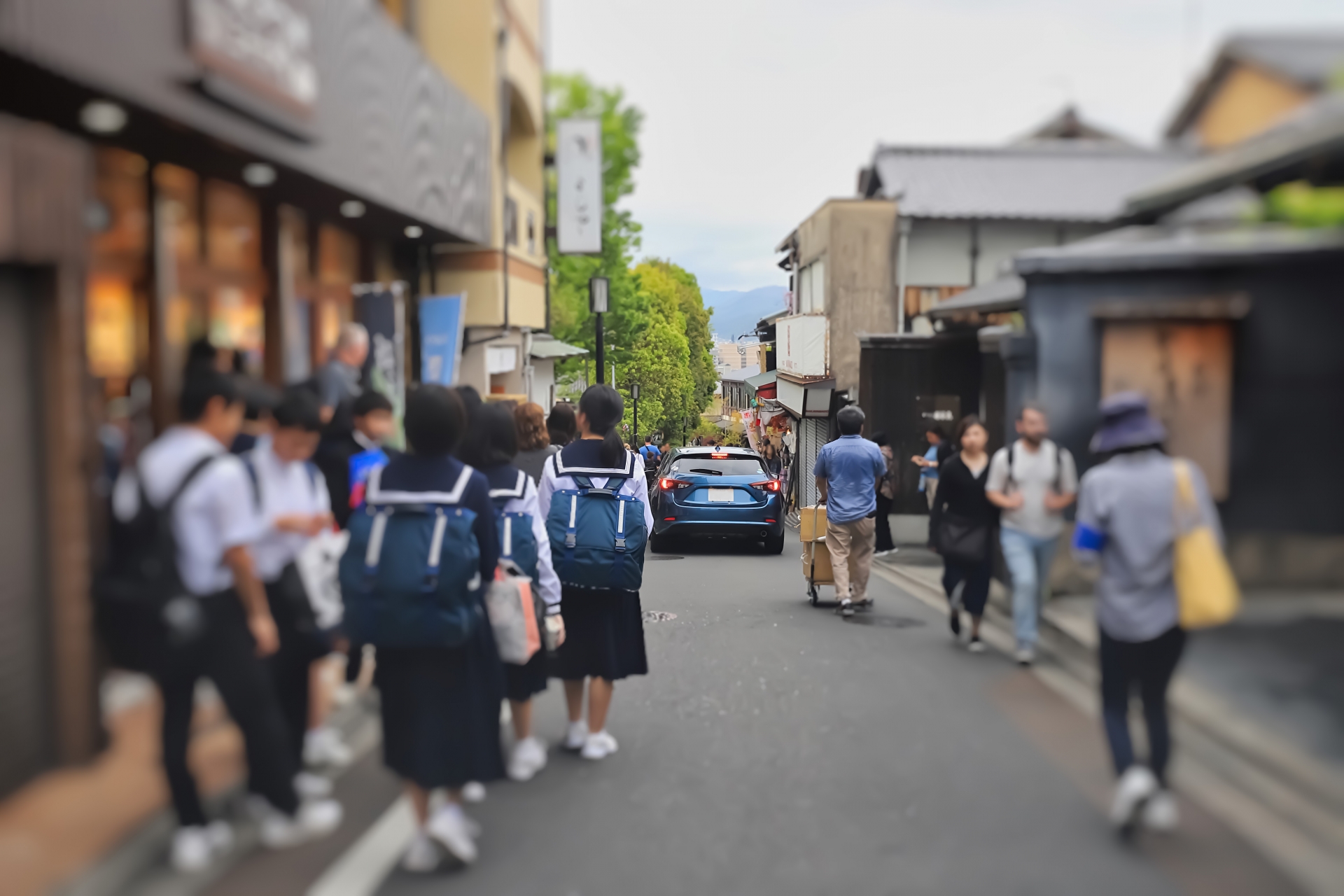 A small street crowded by Junior high school students in Kyoto