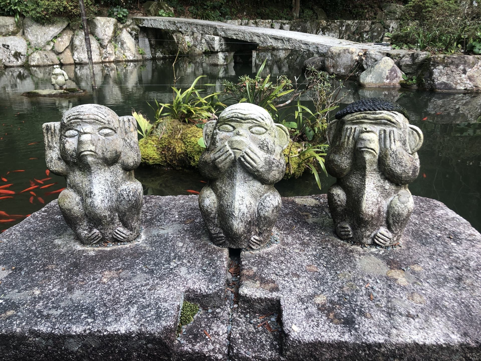 Three stone statues of see no evil, say no evil, and hear no evil