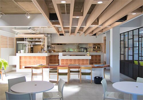 A casual restaurant equipped with wooden tables and chairs