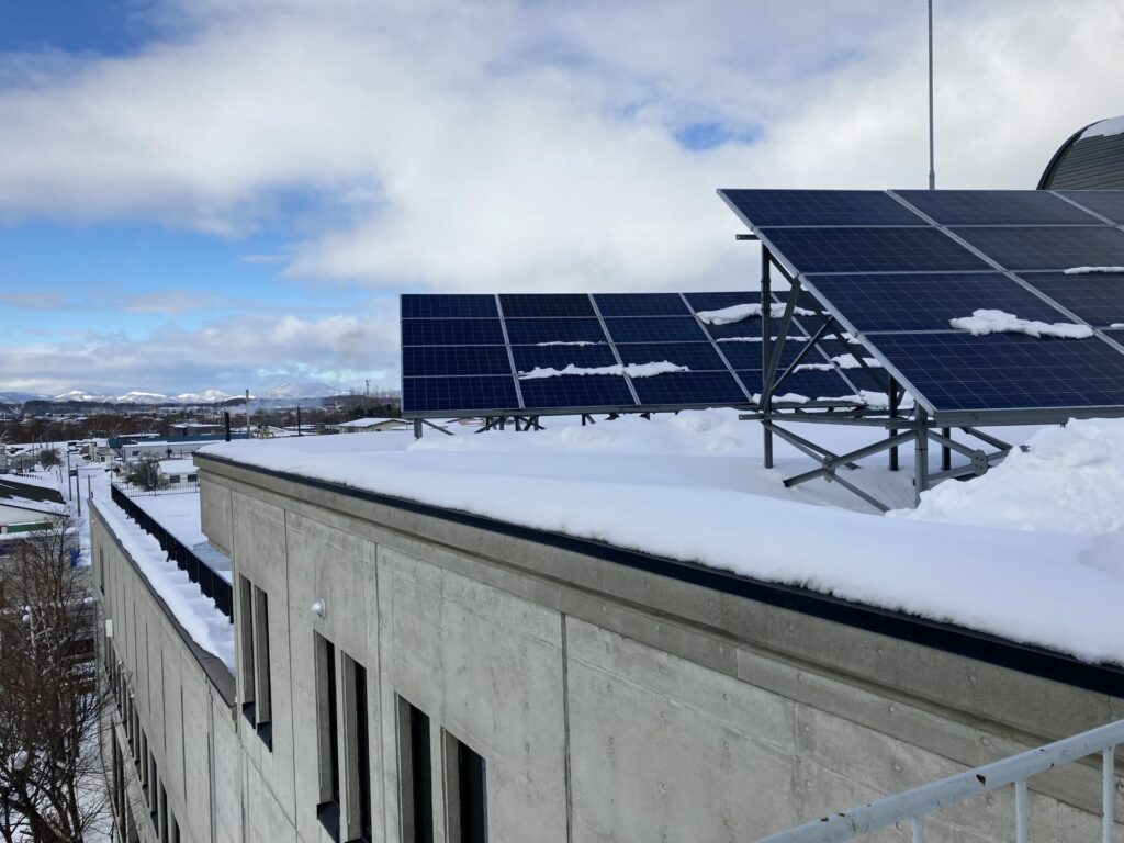 The roof top of our company. There are solar panels, though they're partially covered with snow.