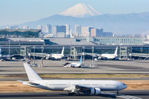 The appearance of Tokyo Haneda airport with Mt. Fuji in the back.