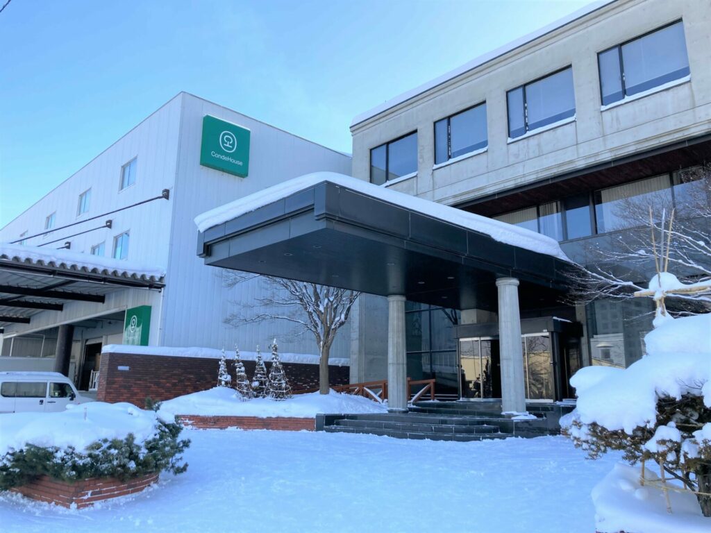 The entrance of CondeHouse headquarters, covered with snow in winter.